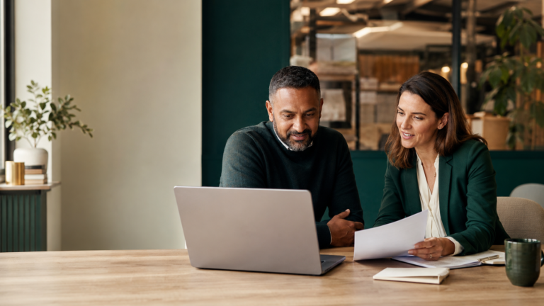 Business owner reviewing invoice finance costs and facility terms with a Go-Factor finance specialist